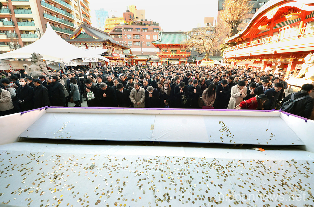Japanese businessmen praying for thriving business at Tokyo's Kanda Myojin