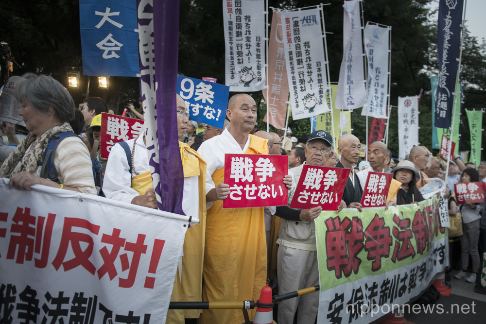 Japanese gather outside parliament to protest against suggested changes to the constitution on June 24, 2015 in Tokyo, Japan. As Japanese parliament debates changing the interpretation of Article 9 of the constitution public opinion is strengthening against Prime Minister Abe and every Friday demonstrations are organised. On June 24th some 2000 people gathered to oppose any changes and to call for peace. (Photo by Alessandro Di Ciommo/AFLO)