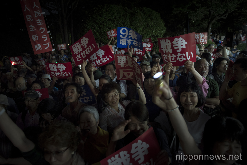 Japanese gather outside parliament to protest against suggested changes to the constitution on June 24, 2015 in Tokyo, Japan. As Japanese parliament debates changing the interpretation of Article 9 of the constitution public opinion is strengthening against Prime Minister Abe and every Friday demonstrations are organised. On June 24th some 2000 people gathered to oppose any changes and to call for peace. (Photo by Alessandro Di Ciommo/AFLO)