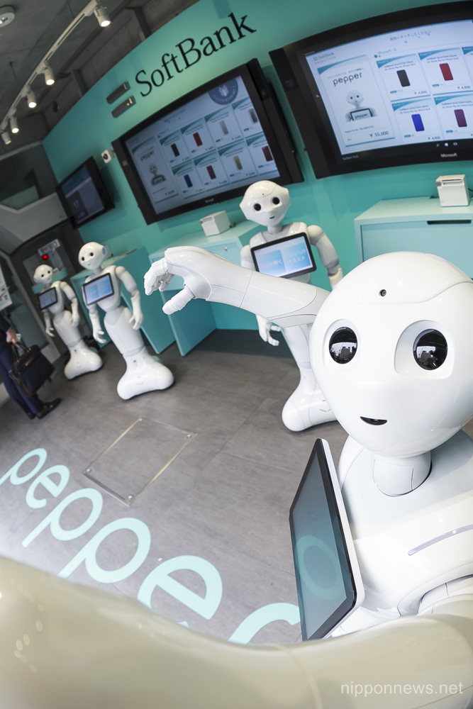 SoftBank Japan opens a phone store staffed entirely by robots in the upmarket Omotesando shopping area on March 24, 2016, Tokyo, Japan. A team of 10 humanoid Pepper robots run the Pepper Phone Shop serving customers buying SoftBank mobile phones. The store is a world first exclusively staffed by robots and will be open until March 30. (Photo by Rodrigo Reyes Marin/AFLO)