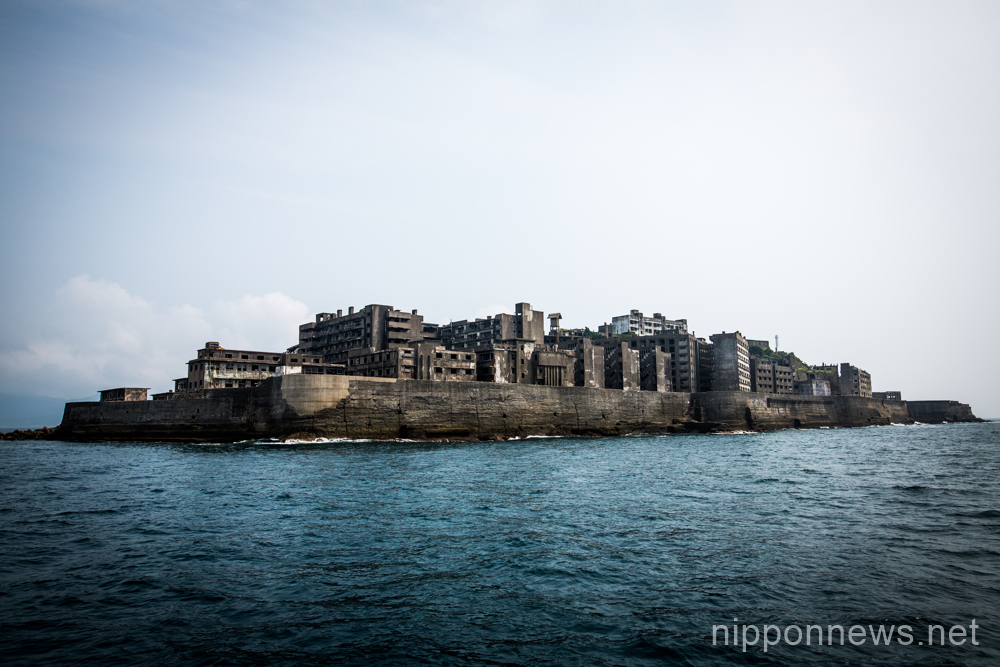Tourists visit the abandoned island of Gunkanjima or “Battleship Island”