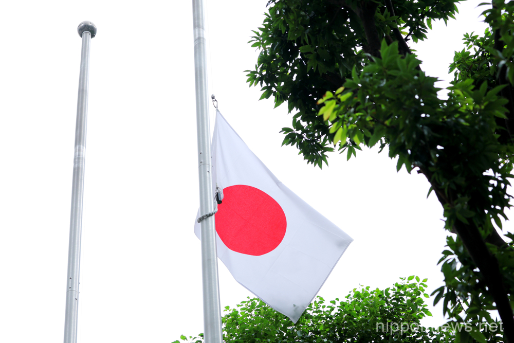 The Japanese flag flies at half-mast at the Chiyoda Ward Office ahead of the state funeral for Japan's former Prime Minister Shinzo Abe in Tokyo, Japan on September 27, 2022. (Photo by Naoki Nishimura/AFLO)