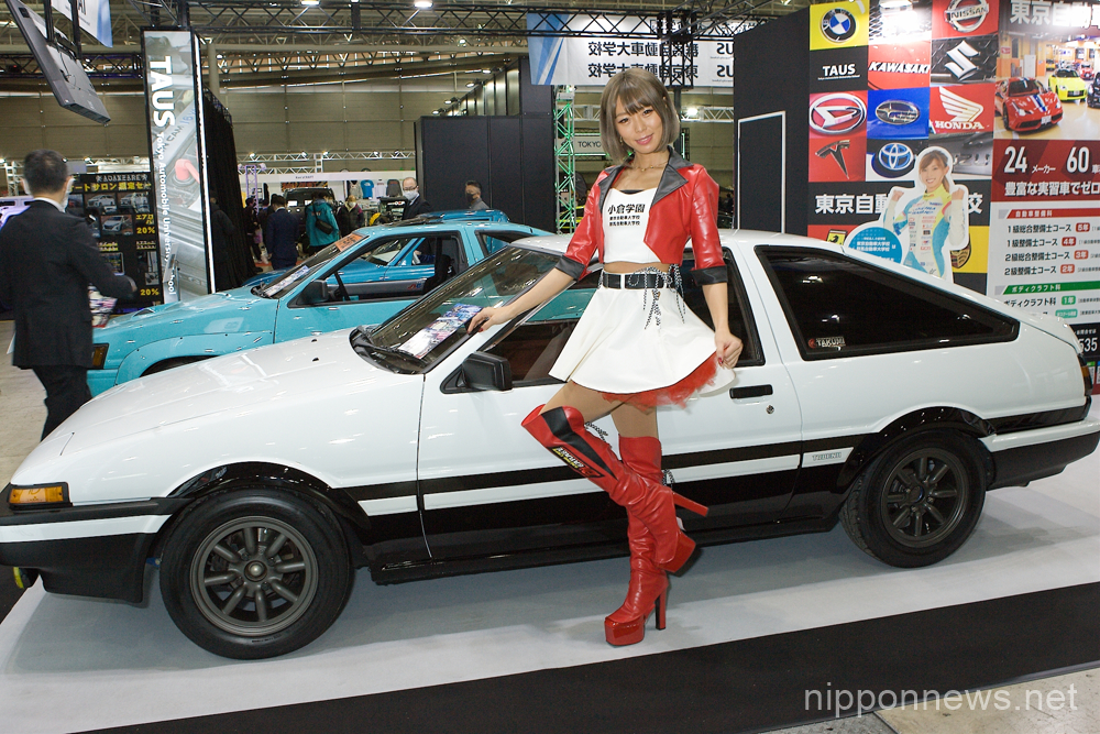 A model poses with a vehicle at the Tokyo Auto Salon 2023 at Mahuhari Messe on January 13, 2023 in Chiba, Japan. The event will be held from January 13th - 15th. (Photo by Michael Steinebach/AFLO)