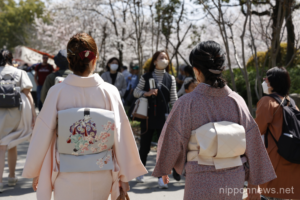 People gather at Osaka Castle Park's Nishinomaru Garden to see the cherry blossoms in full bloom on March 28, 2023, in Osaka, Japan. The cherry blossom season started officially on March 19 in Osaka, four days earlier than last year. (Rodrigo Reyes Marin/AFLO)