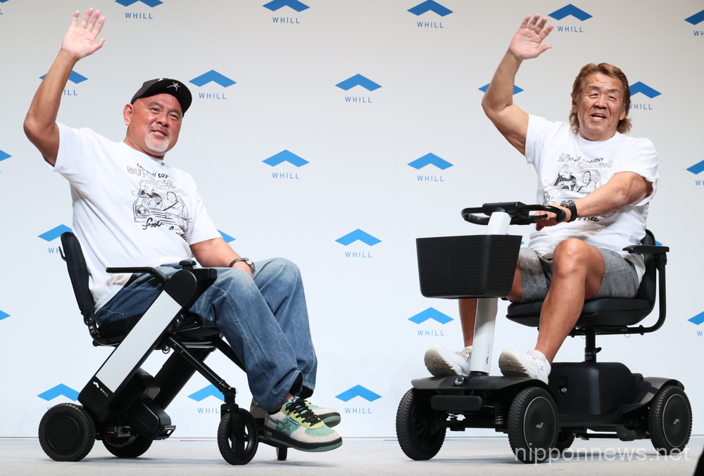 May 11, 2023, Tokyo, Japan - Former professional wrestlers Muto Keiji (L) and Choshu Riki (R) ride personal mobilities "Whill model F" (L) and "Whill model S" (R) as they attend a promotional event of personal mobility Whill in Tokyo on Thursday, May 11, 2023. Personal mobility company Whill announced to agree dealership with 100 car dealers across Japan to provide service and maintenance for the mobility. (photo by Yoshio Tsunoda/AFLO)