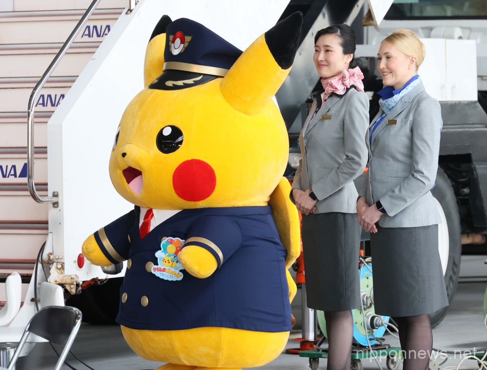 June 3, 2023, Tokyo, Japan - Japan's largest air carrier All Nippon Airways (ANA) cabin attendants smiles with Pokemon's character Pikachu as ANA unveils the Pokemon designed Boeing 787 aircraft "Pikachu Jet NH" at the ANA hangar of the Haneda airport in Tokyo on Saturday, June 3, 2023. ANA will launch the service from June 4 with a Haneda-Bangkok route. (photo by Yoshio Tsunoda/AFLO)