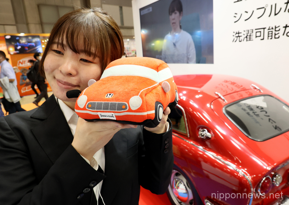 June 8, 2023, Tokyo, Japan - Japanese toy maker Takara Tomy Arts employee displays a Honda car shaped pillow "Baby Smile Honda Sound Sitter" which creates engine sound of Honda's sports car NSX and relaxess cranky babies as the sound feels like mother's womb at the annual Tokyo Toy Show in Tokyo on Thursday, June 8, 2023. Some 150 Japanese and foreign toy makers exhibit their latest products at a four-day exhibition. (photo by Yoshio Tsunoda/AFLO)